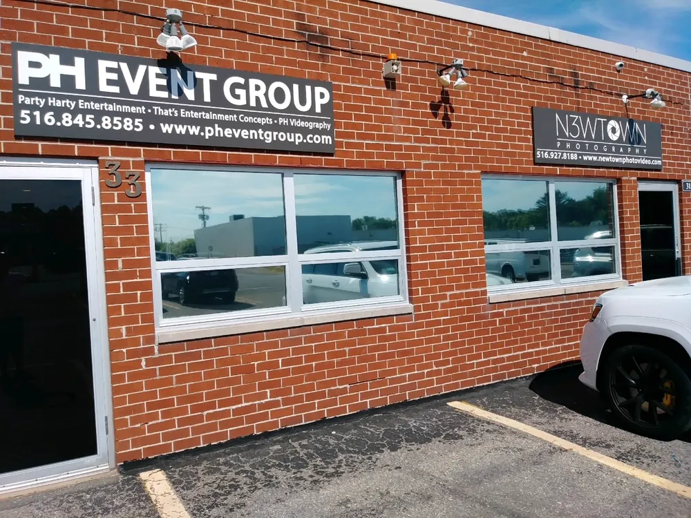 Retail storefront with tinted windows on a Long Island commercial strip